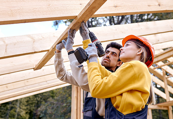 Apprentice and supervision fixing wooden joist